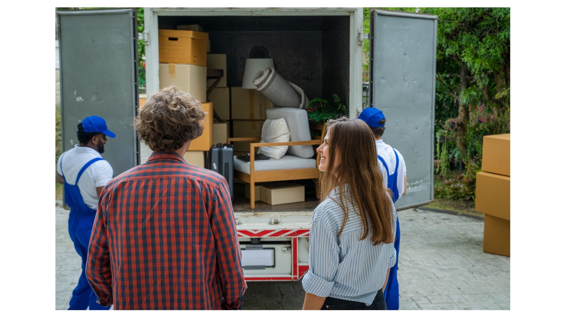 Moving cost Bryan College Station Texas, D&D Moving crew loading boxes onto truck for a local move in College Station TX